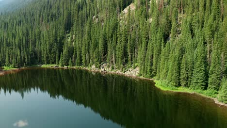 descending aerial footage over beaver lake in beaver creek, colorado