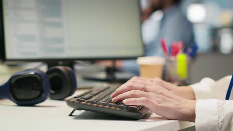close up of it expert coding with ai language model assistance in startup office