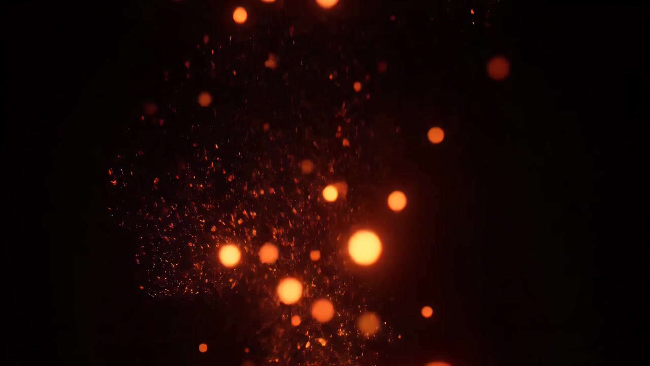 Glowing Orange Fire Sparks Floating Against Black Background
