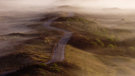 misty morning ride through dunes