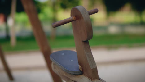 wooden seesaw seat in natural park close shot