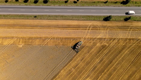 combine harvester collecting barley