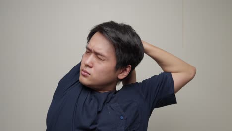 chinese man stretches and cracks his joints