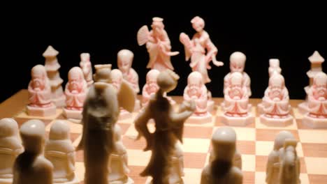 ivory chess board spining, zoom in close up in black background