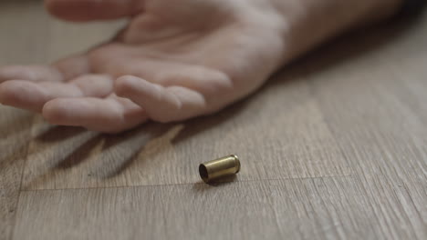 fired 9mm shell casing lying on the floor