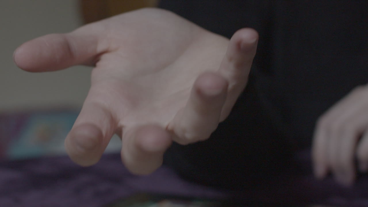 Female hands throwing dice up and catching them in slow motion