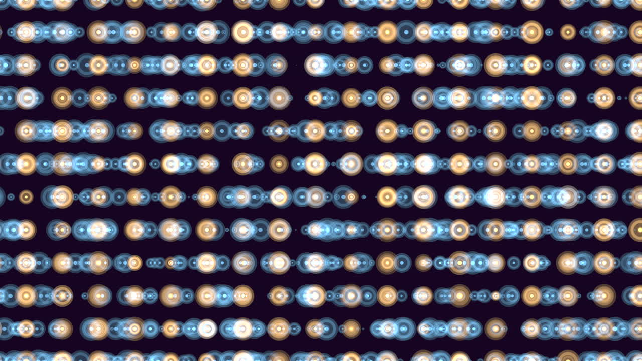 Defocused bokeh lights form horizontal rows of glowing circles in blue and warm tones on a dark background, creating an abstract festive pattern for motion design
