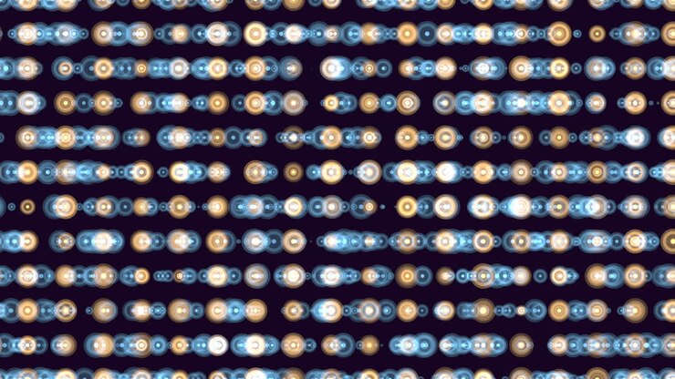 Luci bokeh sfocate formano file orizzontali di cerchi luminosi nei toni del blu e caldi su uno sfondo scuro, creando un motivo festivo astratto per il motion design.