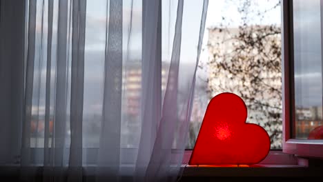 red heart decorated window