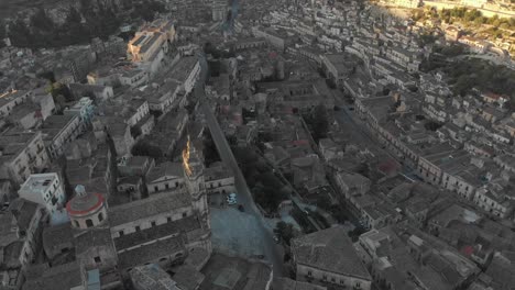 drone view of cathedral of saint george in historic town of modica, aerial