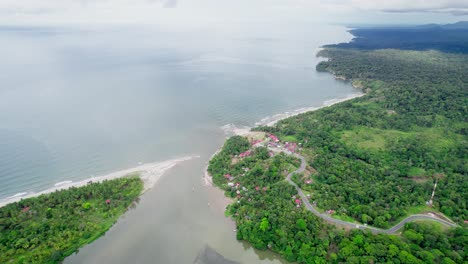 river leading to coastal village and ocean