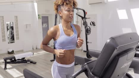 Confident-woman-training-in-gym