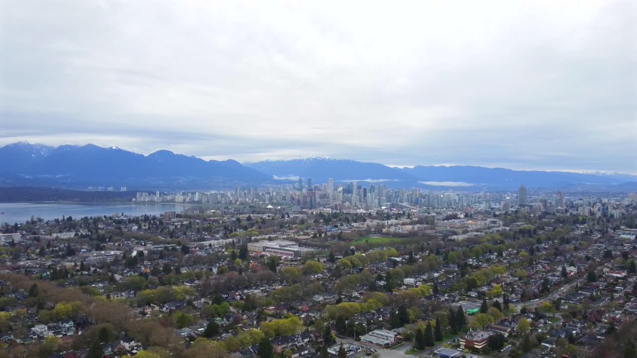Aerial view of Vancouver city skyline with residential neighborhoods in Canada
