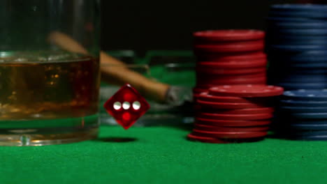 red dice falling on casino table