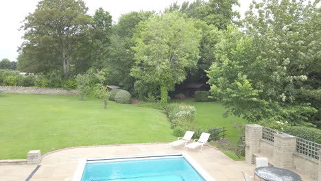 dolly shot of a contemporary guest bedroom with balcony and pool view