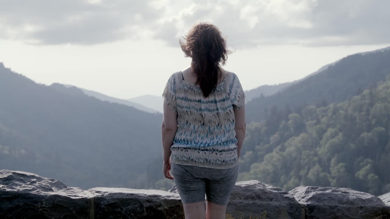 Middle aged woman looking at mountain view in the Great Smoky Mountains National Park in slow motion