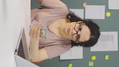 Vertical-video-of-Female-student-doing-e-commerce-shopping.