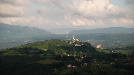 sitting on hill the village of plomin dominated by a romanesque bell tower 15 m high