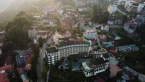 Panning-aerial-shot-of-buildings-in-the-heart-of-the-foggy-Asian-town