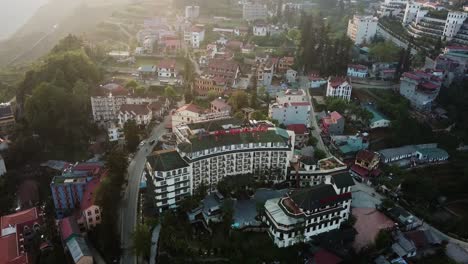 panning aerial shot of buildings in the heart of the foggy asian town