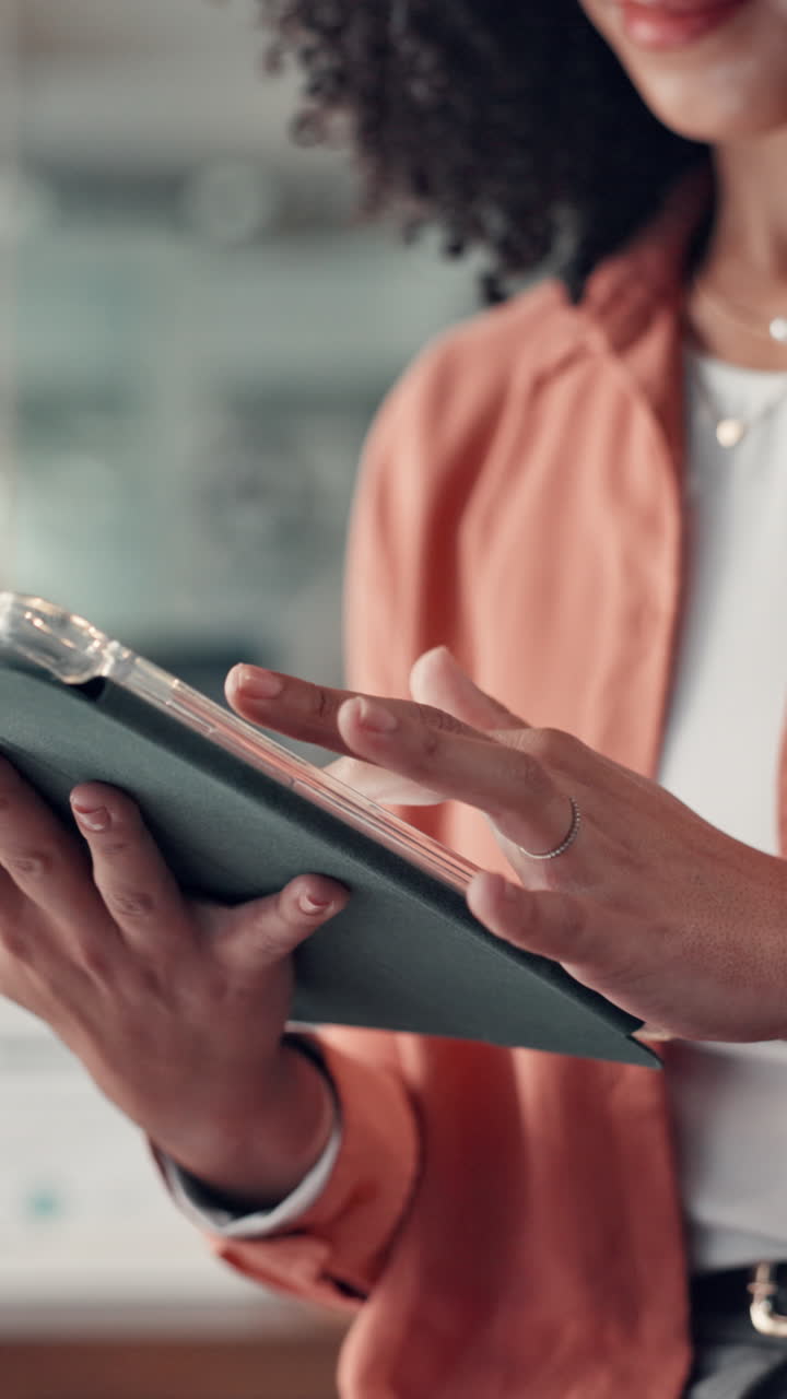 Close Up of Woman's Hands Using a Digital Tablet