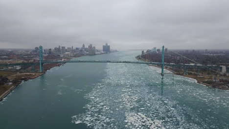 vehicles crossing the ambassador bridge between detroit and windsor in winter