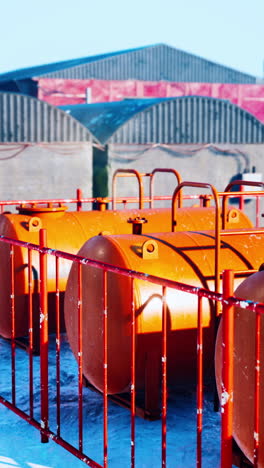 orange fuel tanks in a winter landscape