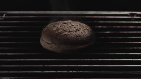 toasted sesame seed burger bun on a grill