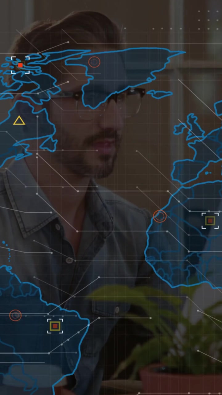 Analyst typing at desk, initiating expanding world map HUD and analyzing global tech data