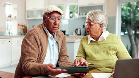 senior couple managing finances at home