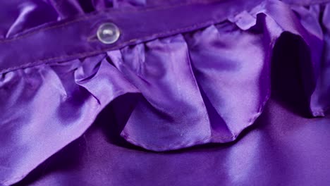 purple ruffles close-up. sewing a violet dress. handmade tailoring, professional clothing concept. abstract background