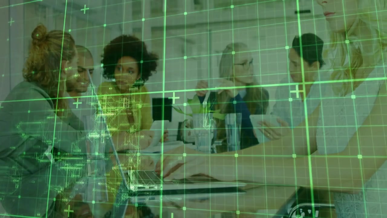 Team leaning forward at conference table collaborating on data analysis with green grid overlay