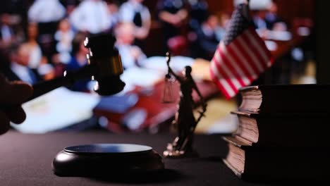the atmosphere of the courtroom vividly displays the symbols of justice