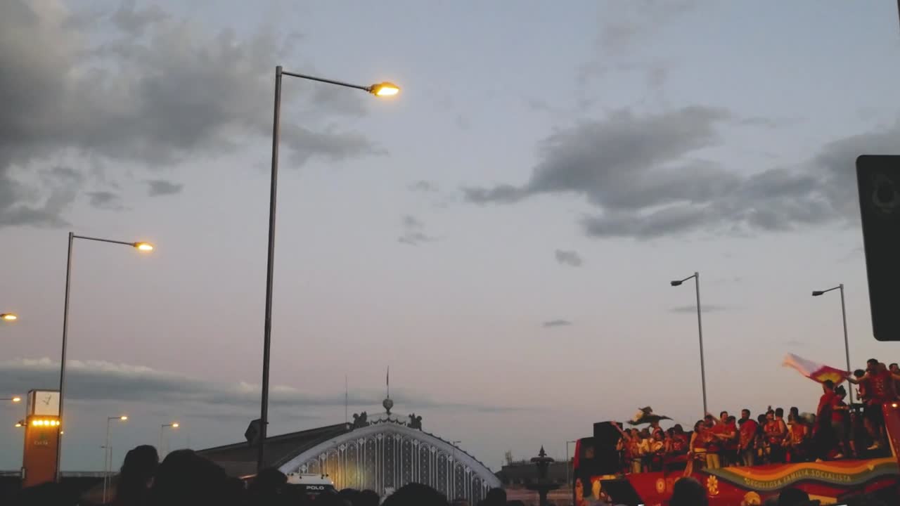 Experience a vibrant Pride float during sunset in Madrid. This lively LGBT parade showcases colourful flags and joyful celebrations, capturing the essence of diversity and unity.