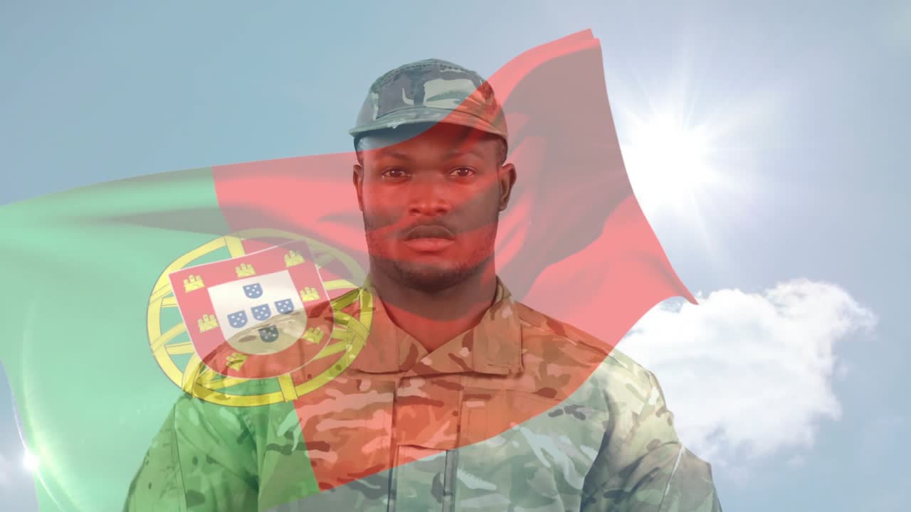 Camera tilting up, soldier holding folded US flag, lowering, saluting under waving PT flag to honor