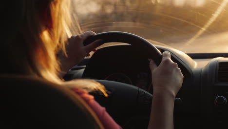 silhouette of a female driver driving a car