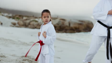 beach, karate teacher or kid learning martial