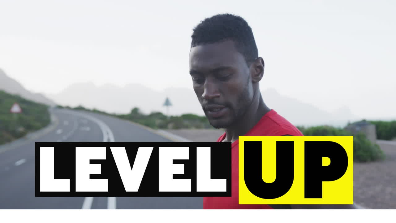 Animation of the words level up in black and white over man exercising on mountain road resting
