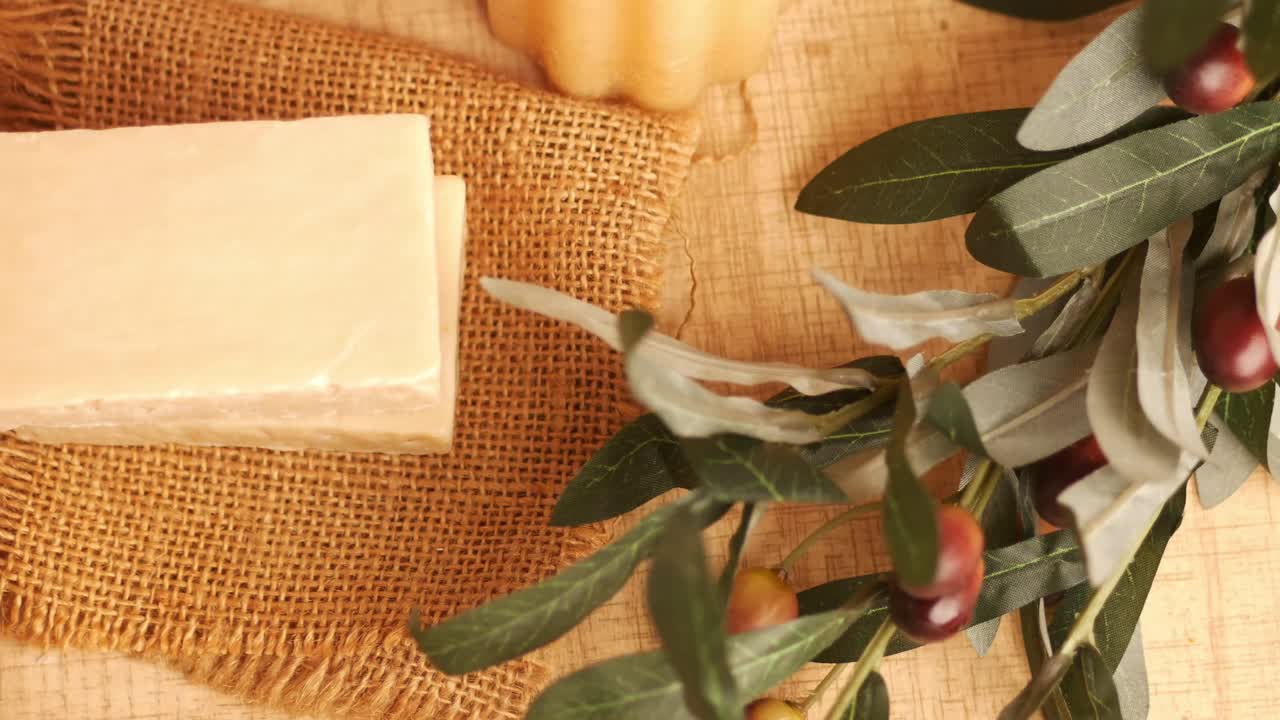 Handmade natural soap with olive branch decoration