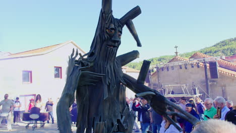 large wooden sculpture at public art festival