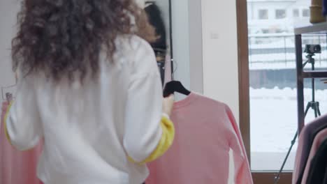 woman shopping for clothes in a clothing store