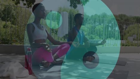 animation of ying yang icons over african american couple meditating
