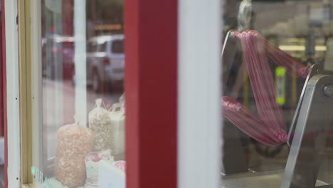 taffy being made in storefront window