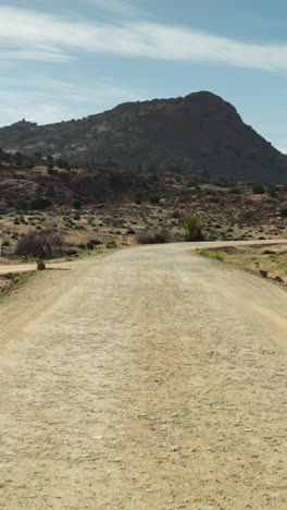 driving-in-atlas-mountains,-morocco-in-vertical