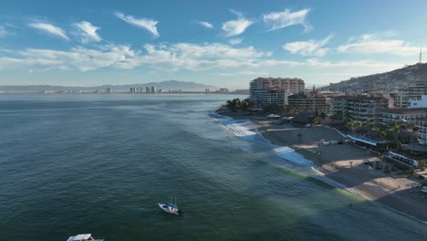 Playa-De-Los-Muertos-beach-and-pier-close-to-famous-Puerto-Vallarta-Malecon,-the-city-largest-public-beach