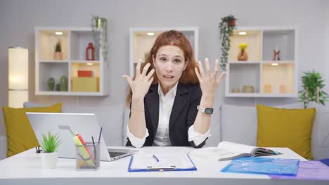 home office worker woman looking nervously at camera.