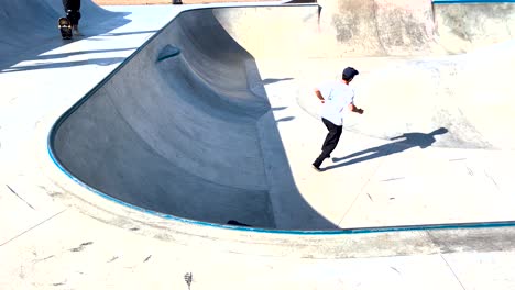 man performing stunts on top of a high ramp at estoril skatepark