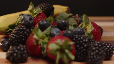 fruit being dropped onto a cutting board