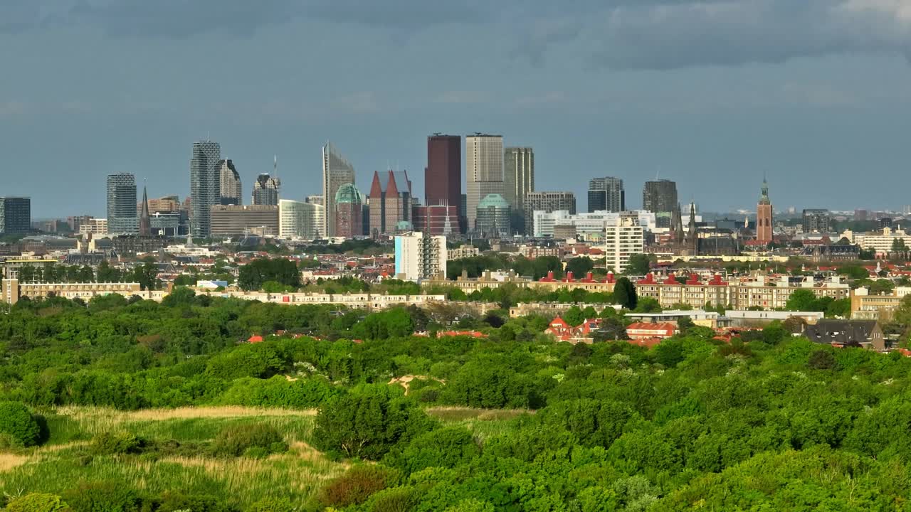 The Hague city skyline view against sky, wide aerial view from over ocean