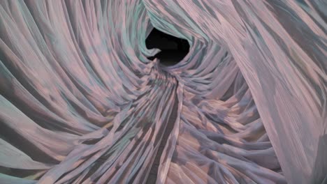 Luminous fabric tunnel swirling with shadowy patterns, generating mystical visual illusion through intricate light manipulation and dynamic texture
